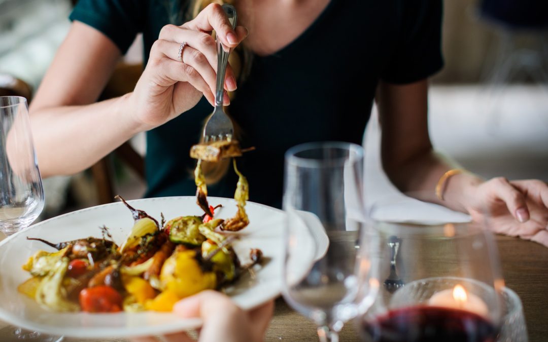 Woman eating at restaurant stock image